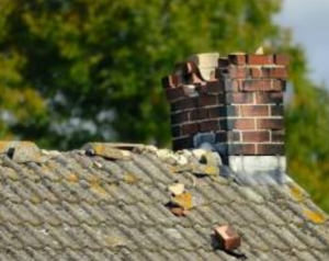 Cracked chimney brick masonry mortar damaged home exterior 