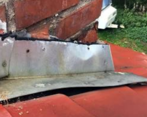 Damaged chimney flashing leaking roof water storm damage 
